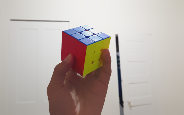 Rubix cube held up by David Vytopil/irmonus hand